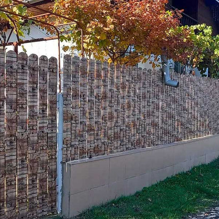 Esempio di recinzione realizzata con steccato TISA effetto muro di granito